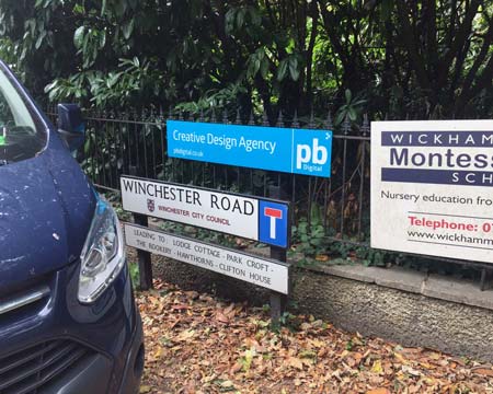 Fence sign for PB Digital