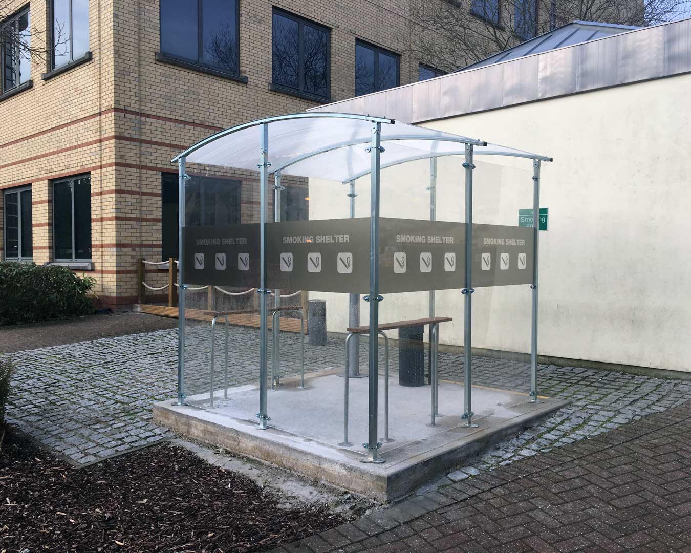 Manifestation graphic on a smoking shelter