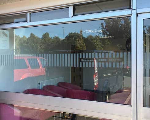 Manifestations a glass pane with frosted manifestation applied